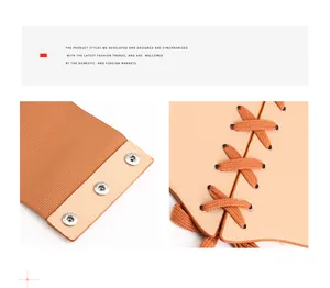 Detail of khaki corset belt featuring silver metal snaps and orange decorative laces