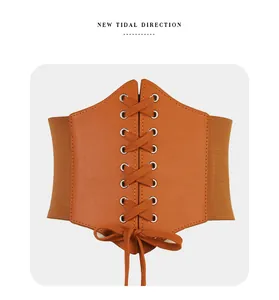 Detail of vintage camel wide waist belt with lace-up front and elastic stretch band