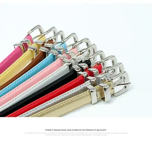 Detail of colorful slim glossy leather belts with silver metal buckles and loops