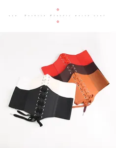 Detailed stack of wide elastic waist cincher belts in black, cream, red and brown tones