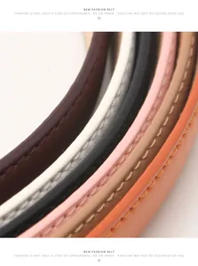 Close-up of colorful leather belts with precision stitching and antique silver finish