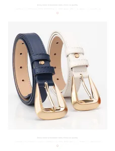 Close-up of women's thin belts in navy and white with polished gold buckles and cross pattern