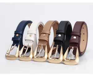 Close-up of stylish women leather belts with irregular matte gold buckles in various colors