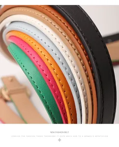 Macro shot of colorful slim leather belts showing detailed stitching and varied textures