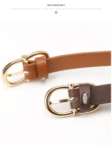 Detail of brown leather women belts featuring gold D-shaped buckles and fine texture