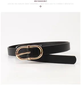Close-up of black PU leather belt featuring a golden oval buckle in minimalist style