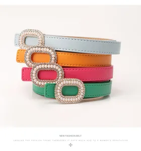 Detail of luxury thin belts for women with pearl and rhinestone encrusted oval buckles