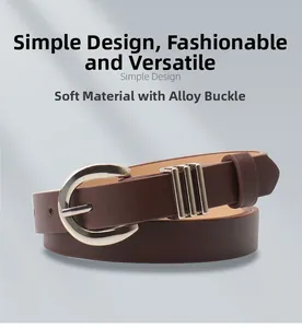 Close-up of soft brown leather belt with silver horseshoe buckle and metal ring details