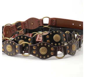 Detail of vintage bohemian wide belt with rivets, sun flower metal buckles and studs