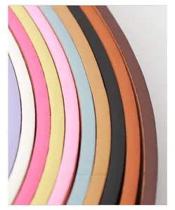 Close-up of colorful leather belts showing high-quality smooth edge oil craftsmanship