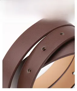 Detailed view of dark brown high-quality PU leather belt with circular adjustment holes
