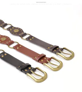 Three vintage leather belts with ornate metal buckles and bohemian studs in various colors