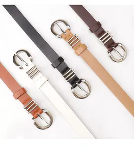 Detail of slim women's belts in four colors with stylish silver round pin buckles