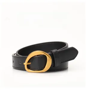 Detail of black leather belt with gold irregular oval buckle and fine stitching