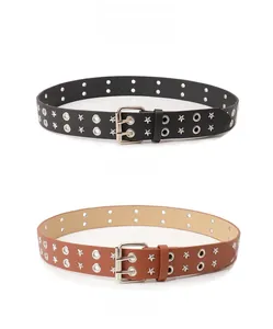 Close-up of black and camel punk belts featuring star rivets and double-row metal eyelets