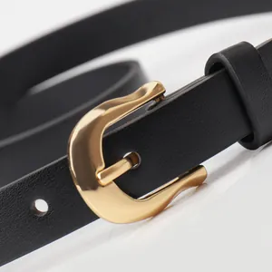 Women's slim black leather belt with minimalist wavy gold buckle for casual jeans