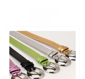 Detail of slim leather belts for women with silver crescent buckles in five colors