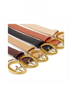 Detail view of multi-color women's faux leather belts with vintage gold oval pin buckles