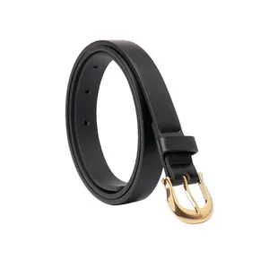 Elegant women's slim black belt with a polished golden horseshoe buckle for jeans