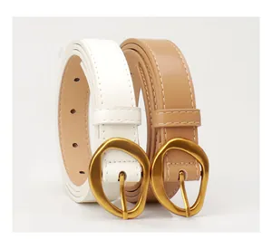 Detail of white and khaki women's belts with irregular matte gold pin buckles