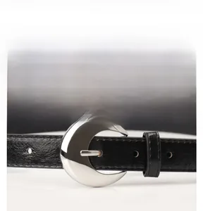 Detailed close-up of a black leather belt with a crescent-shaped silver alloy buckle