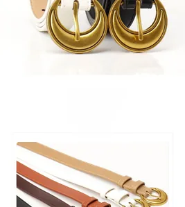 Detail of vintage moon-shaped buckle and multicolored slim leather belts set for women