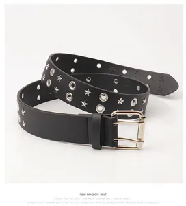 Detail of black punk leather belt with silver star studs and metal eyelets