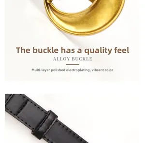 Close-up of polished gold alloy buckle with high-end texture and black leather strap