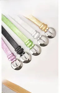 Detail showing high-shine metallic finish belts in five colors with silver buckles
