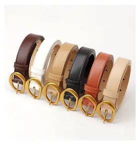 Detail of six narrow leather belts with golden horseshoe buckles in diverse colors