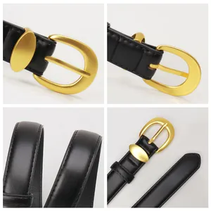 Women's black leather belt with matte gold horseshoe buckle and fine stitching