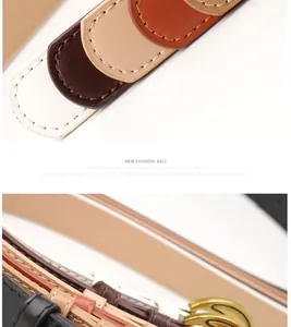 Detailed close-up of retro moon buckle leather belts showing fine stitching and gold pins