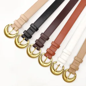Set of six vintage moon buckle leather belts for women in diverse colors on white background