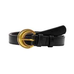 Vintage black leather belt for women with a gold crescent moon buckle and matte finish