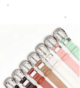 Close-up of retro carved alloy buckles and colorful leather belts for women