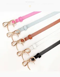Detailed view of slim women's belts in five colors with golden bow-shaped metal buckles
