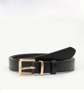 Detail of black leather belt featuring high-quality stitching and golden square buckle