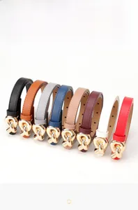 Close-up of slim leather belts for women in eight colors with golden twist buckles