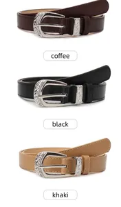 Detailed view of vintage carved silver buckles and stitching on three colored leather belts