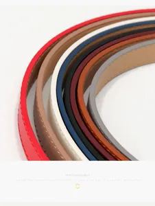 Close-up of colorful slim PU leather belts for women showing texture and stitching detail