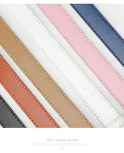 Detailed close-up of textured leather belts in various colors with precision edge stitching