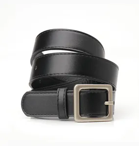 Detail of minimalist black leather belt with matte silver square buckle and fine stitching