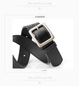 Detail of minimalist black leather belt with matte silver square buckle for women