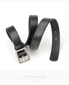 Detail of minimalist black leather belt with matte silver square buckle for women