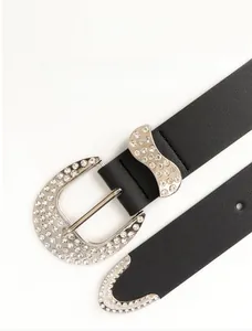 Detailed view of Y2K vintage black leather belt featuring rhinestone studded buckle and tip