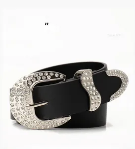 Detail of Y2K vintage black belt featuring a rhinestone-encrusted buckle and silver accents