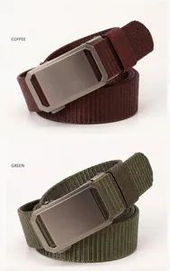 Detail of coffee and green tactical nylon belts with brushed metal buckles on white background