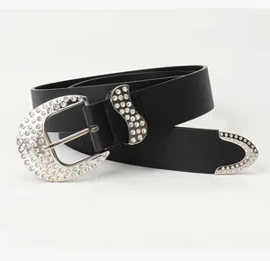 Close-up of Y2K vintage black leather belt featuring shiny rhinestones and silver buckle