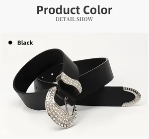 Detail show of black leather belt with sparkling rhinestones and ornate silver buckle