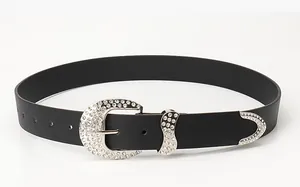 Close-up of Y2K vintage black leather belt featuring silver hardware and encrusted rhinestones
